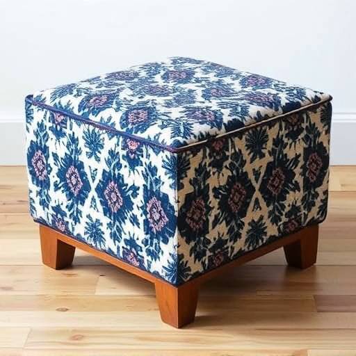 A stylish ottoman upholstered in a geometric patterned fabric, with a sturdy wooden frame.